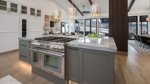 a kitchen with a stove and a counter top at Allegro Peak in Steamboat Springs +27 photos