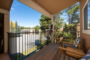 a screened porch with a bench on a deck at Beaver Village Unit #2031 in Winter Park