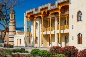 a large building with a tower on the side at Farovon Tashkent Boutique Hotel in Tashkent