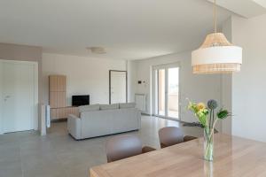 a living room with a table and a couch at Villa Novelli - YourPlace Abruzzo in Fossacesia
