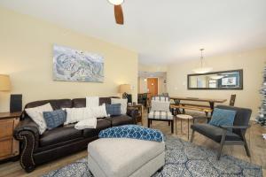 a living room with a couch and a table at Fraser Crossing 3302 in Winter Park