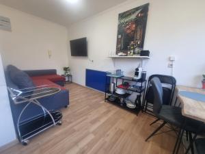 a living room with a couch and a table at Rax-Basecamp 24 in Reichenau