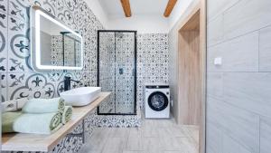 a bathroom with a sink and a mirror at Penzion Pod Vinicemi in Litoměřice