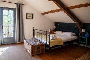 a bedroom with a bed and a large window at Domaine Du Tafiart in Sarron +89 photos