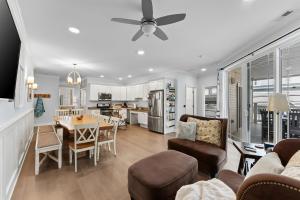a living room with a dining room and a kitchen at 8609 Landis Ave, Condo 201 in Sea Isle City