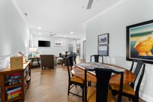 a living room with a table and a dining room at 8609 Landis Ave, Condo 201 in Sea Isle City