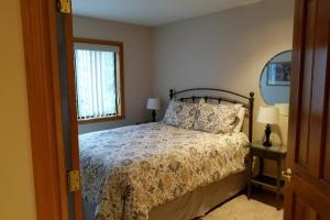a bedroom with a bed and a window at 4 Approach Lane in Sunriver +14 photos