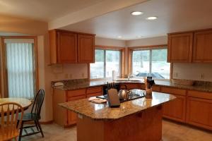 a kitchen with wooden cabinets and a counter top at 4 Approach Lane in Sunriver