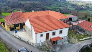 an overhead view of a house with an orange roof at Casa da Madrinha - Paredes de Coura in Paredes de Coura
