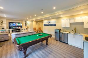 a living room with a pool table in it at Beach House First Floor in Pickering +16 photos