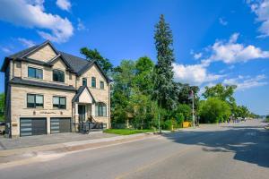 a house on the side of a street at Beach House First Floor in Pickering