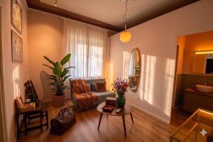 a living room with a couch and a table at Villa alle Mura in Lucca
