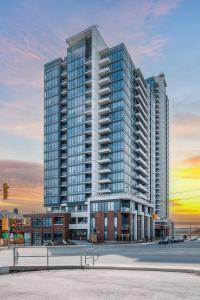 a rendering of a tall building in a city at Modern & Stylish Condo Downtown KW in Kitchener