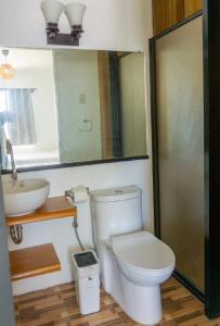 a bathroom with a toilet and a sink at Virmuda Villa Rental in Po-oc +5 photos