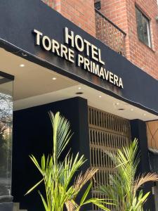 a hotel sign on the front of a building at Hotel Torre Primavera in Medellín