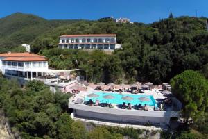 a resort with a swimming pool and a building at Marilena Sea View Hotel in Pyrgi
