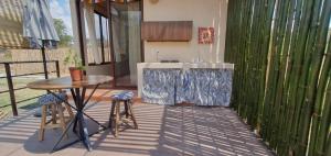 a kitchen with a sink and a table on a patio at Casa Catonalco in Xalmolonco
