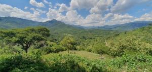 a view of a valley with mountains and trees at Casa Catonalco in Xalmolonco +26 photos
