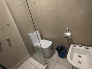 a bathroom with a toilet and a sink at Hotel Munay La Quiaca in La Quiaca +22 photos