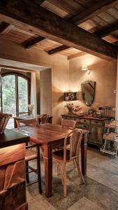 a dining room with a wooden table and chairs at Agriturismo Missanega in Monterosso al Mare