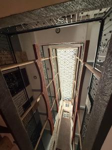 an overhead view of a staircase with a window at The Reset Stay in Kampala +42 photos