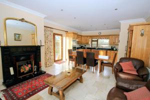 a living room with a table and a fireplace at Laurel Lodge in Virginia