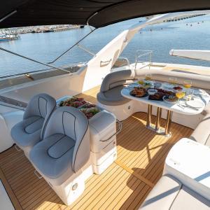 a deck of a boat with a table with food on it at The Lux Yachts - Luxury Private Yacht Experience in Helsinki