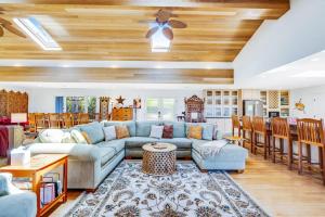 a living room with a couch and a table at Voyagers Paradise in Gualala
