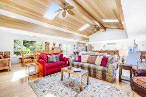 a living room with a couch and a table at Voyagers Paradise in Gualala +26 photos