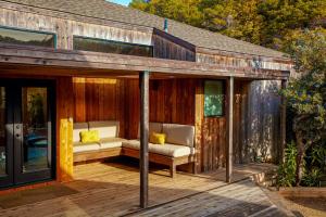 a patio with two couches on a wooden deck at Breakers Hideaway in Sea Ranch