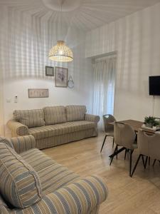 a living room with a couch and a table at Apartamentos Sal de Luna in Toledo