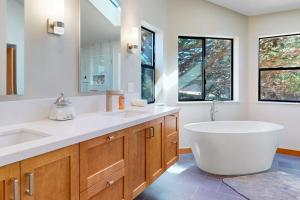 a bathroom with a large tub and a large sink at West Meadow in Sea Ranch +31 photos