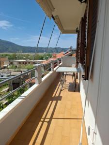 a balcony with a table and a view at Orikum Holiday Apartaments in Orikum