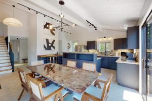 a kitchen and dining room with a table and chairs at The Great Escape in Sea Ranch