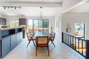 a kitchen and dining room with a table and chairs at The Great Escape in Sea Ranch