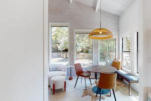 a dining room with a table and chairs at The Great Escape in Sea Ranch