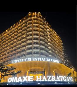 a hotel building with a sign in front of it at Omaxe Lucknow Luxury Home in Nalmatha