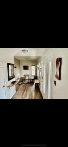 a living room with a table in the middle of a room at Constellation Lake Home in Kasilof +42 photos