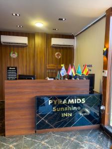 a lobby with a sign that says pyramids surfing inn at Pyramids Sunshine View in Giza
