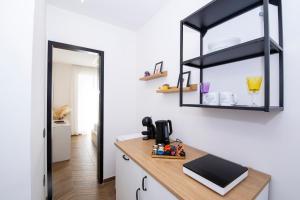 a kitchen with a counter and a mirror on the wall at Residenza sul mare 2 in Naples