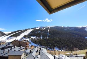 a view of a ski resort with a snow covered mountain at AC Apartaments Apollo Soldeu in Soldeu
