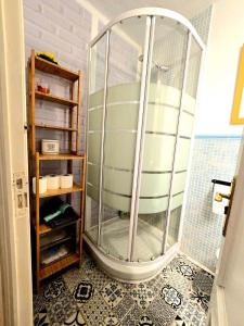 a shower in a bathroom with a large glass tub at Toledo Histórico in Toledo +27 photos