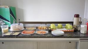 a kitchen counter with many different food items on it at Hotel Luci in Terra Santa