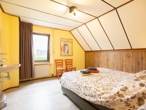 a bedroom with a bed and a sink at Steenenburg Zicht in Nieuwkuijk