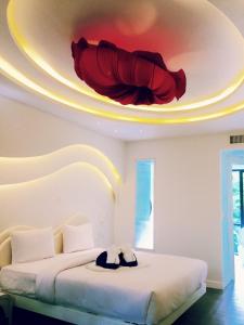 Ένα ή περισσότερα κρεβάτια σε δωμάτιο στο Avatara Resort