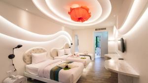 Ένα ή περισσότερα κρεβάτια σε δωμάτιο στο Avatara Resort