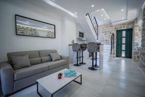 a living room with a couch and a table at Caelum Et Mare in Donja Lastva