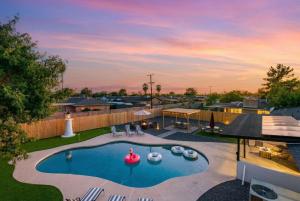 an overhead view of a swimming pool in a backyard at Mesa Oasis - Pool - Game Room - Fire Pit in Mesa