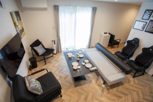 an overhead view of a living room with a table and chairs at Shiro in Hakodate +38 photos