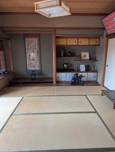 an empty room with a table and a window at Y House in Kurashiki